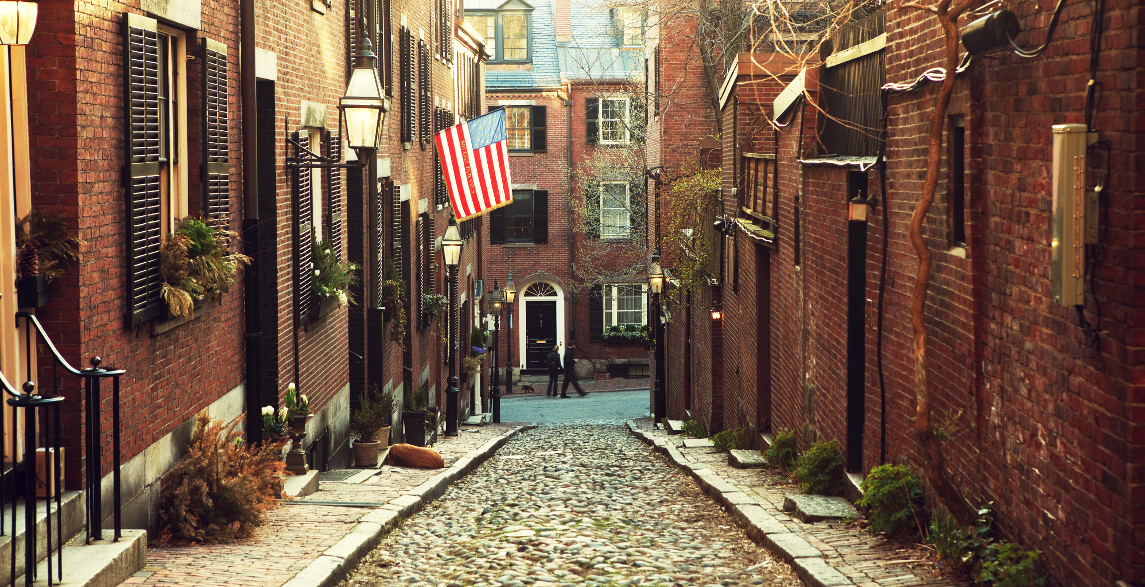 brick houses down a cobblestone road in Beacon Hill, Boston.