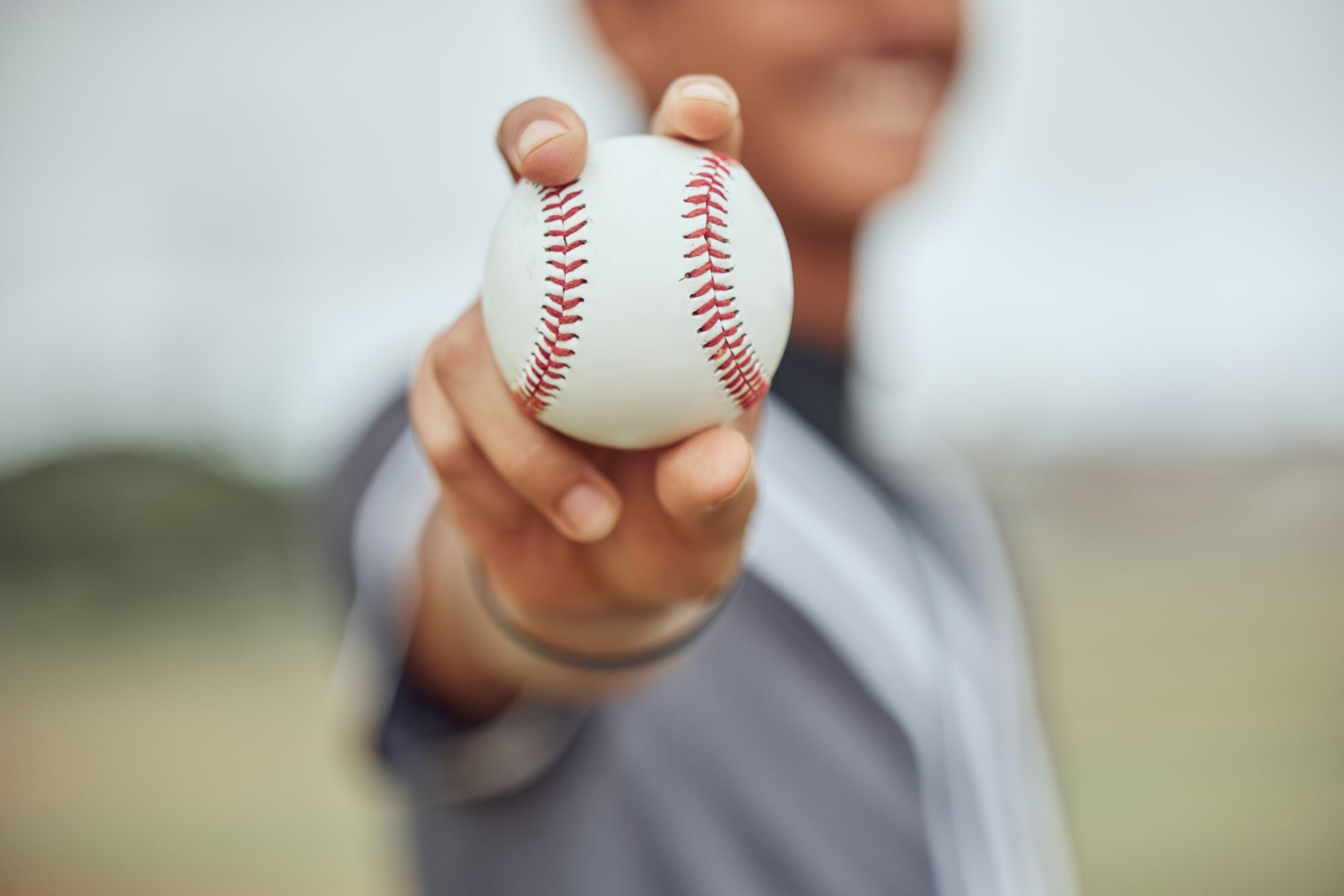athlete with baseball in hand