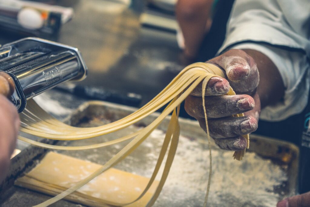 pasta making machine with pasta coming out